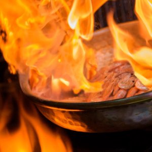 Flames engulfing a cooking pan