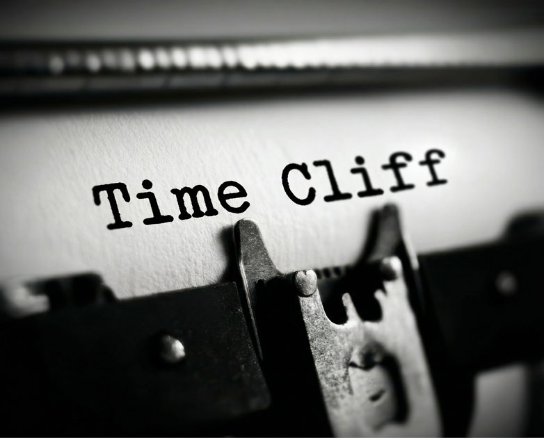 Typewriter printing the words Time Cliff on paper
